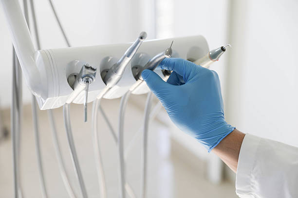 Professional Tooth Extraction technician working in Phoenix, NY